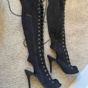 Black thigh high lace up heel boots